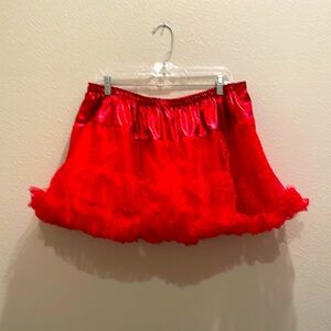 Celebrate Halloween size L - XL, Length 15 3/4 inches red petticoat.Lined. NWOT.